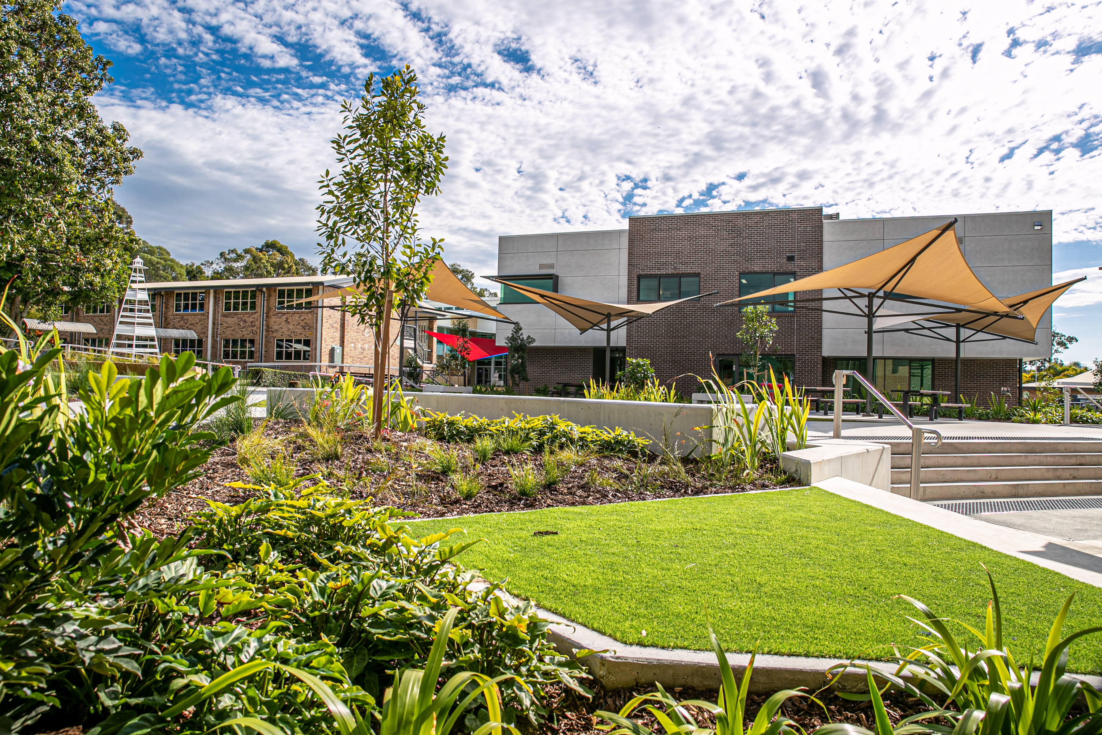 Carmel College outdoor learning spaces showcasing landscaped grounds seating areas and shaded facilities supporting student wellbeing and community connection