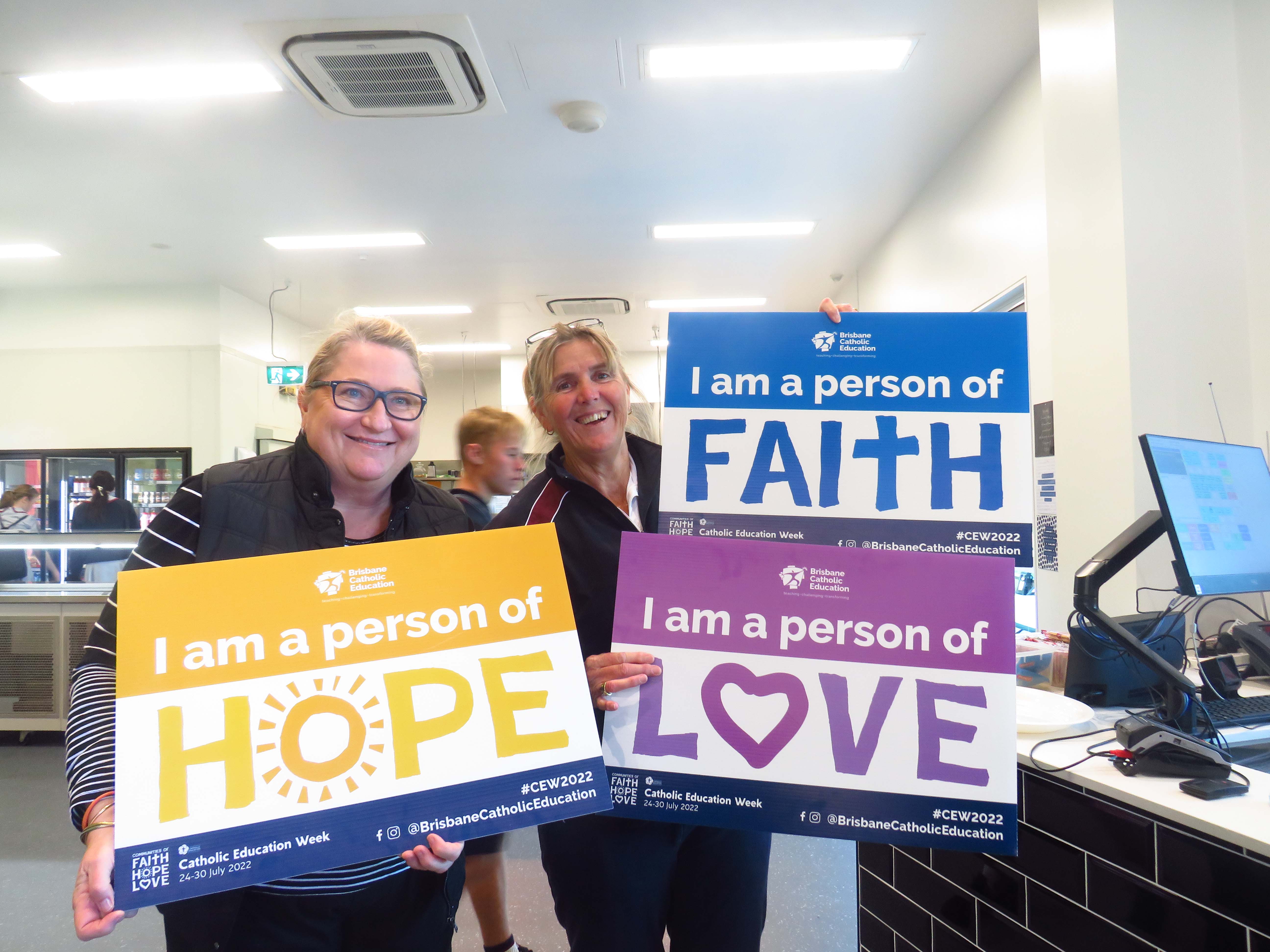 Staff members promoting Catholic Education Week values of faith hope and love within the school community